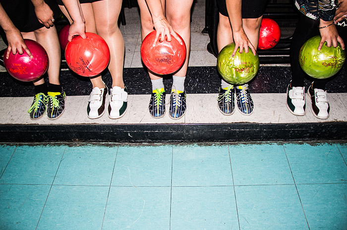 Team mates playing bowling