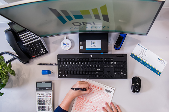 Reception desk at DGL Accountants with staff filling out TFN declaration