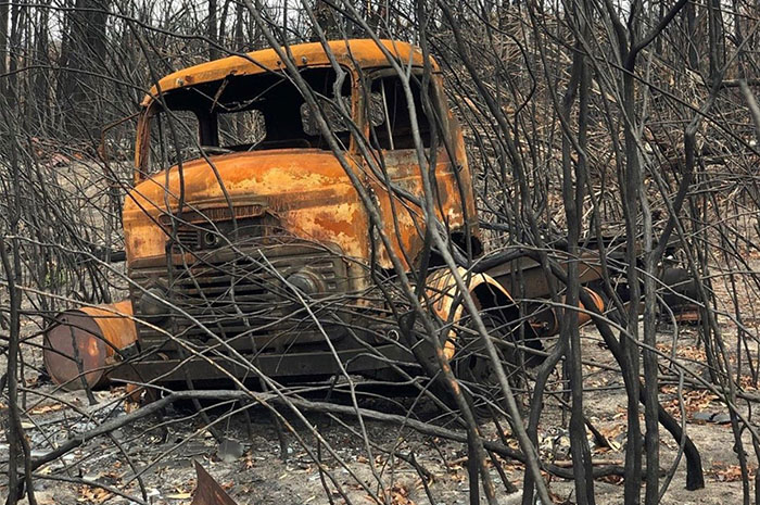 Burnt out truck in fire remains