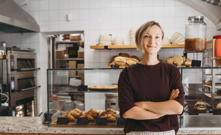 Business Community Person standing in a bakery