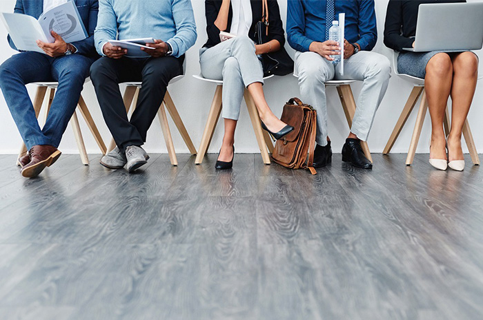 Employees sitting in waiting room for interview