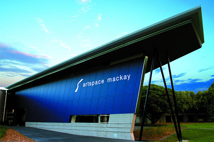 Artspace Building in Mackay green trees and blue sky in background