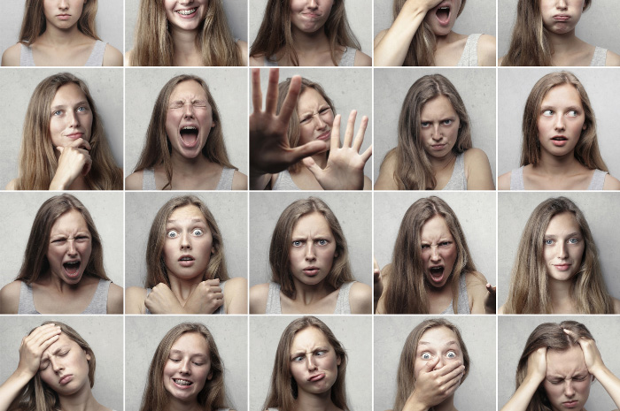 A grid of 20 faces displaying many different personality traits