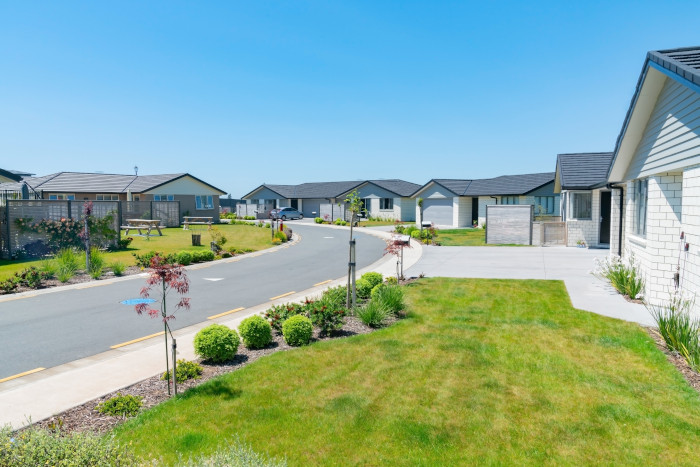 New subdivision street with uniform homes.