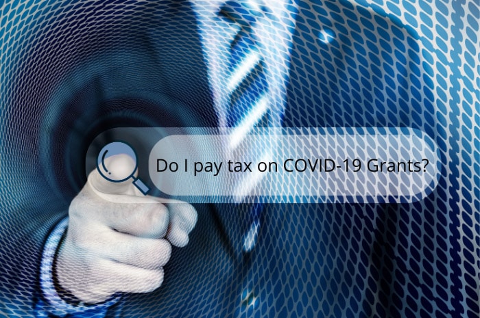 Man in business suit pointing at search bar that reads do I pay tax on COVID-19 grants