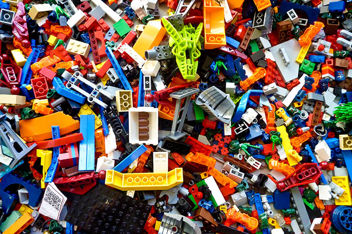 Colourful lego pieces all mixed together in pile