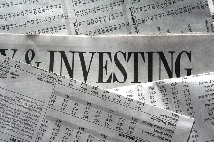 Newspaper with article about investing