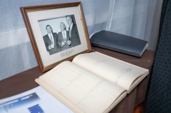 1991 photo of partners and old agenda