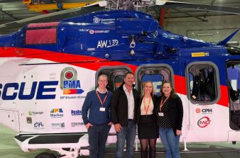 Elizabeth standing if front of new BMA CQ Rescue helicopter