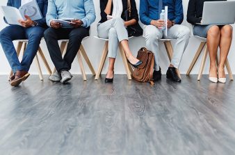 Employees sitting in waiting room for job interview
