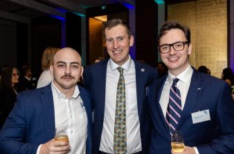 Maitland standing with 2 other men