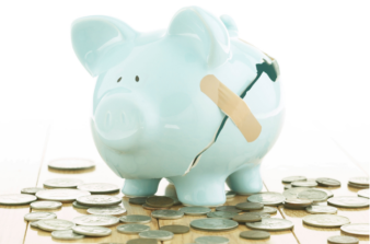 Broken piggy bank with coins spilled out and a band aid over crack